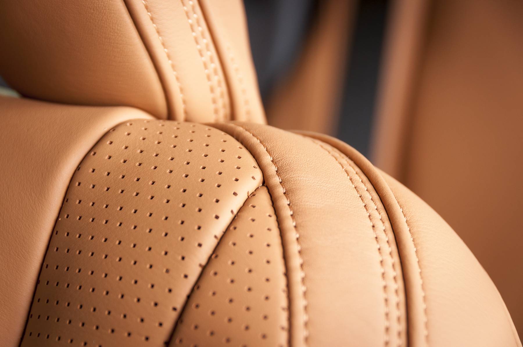 Modern sport car perforated red leather interior